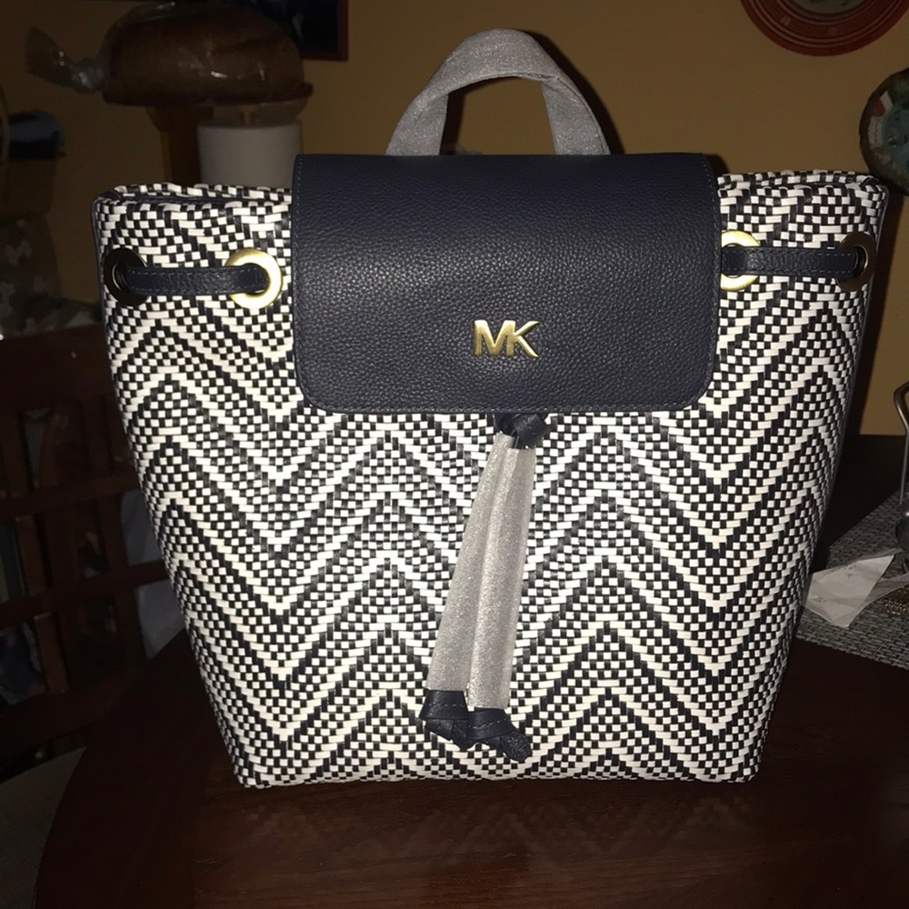 MK Leather Flap Backpack